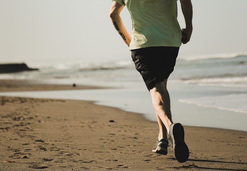 man running on beach